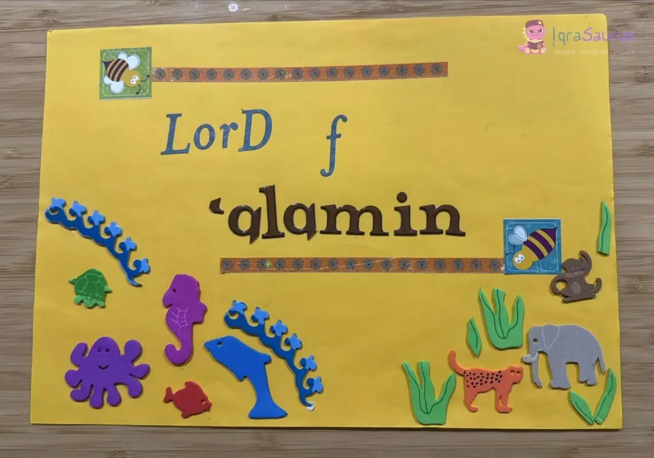 A yellow scrapbook card with sticker letters and foam sea creatures and land animals