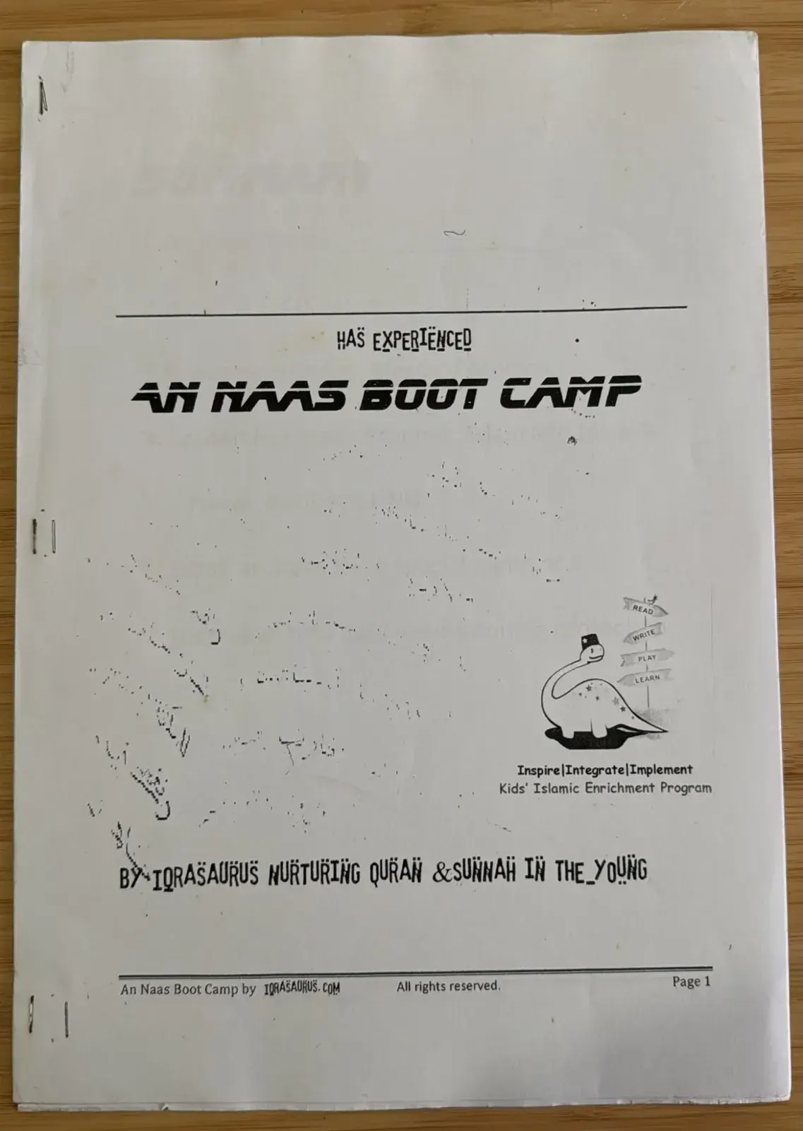 The cover of the An Naas Boot Camp workbook, printed in black and white with an early IqraSaurus dinosaur