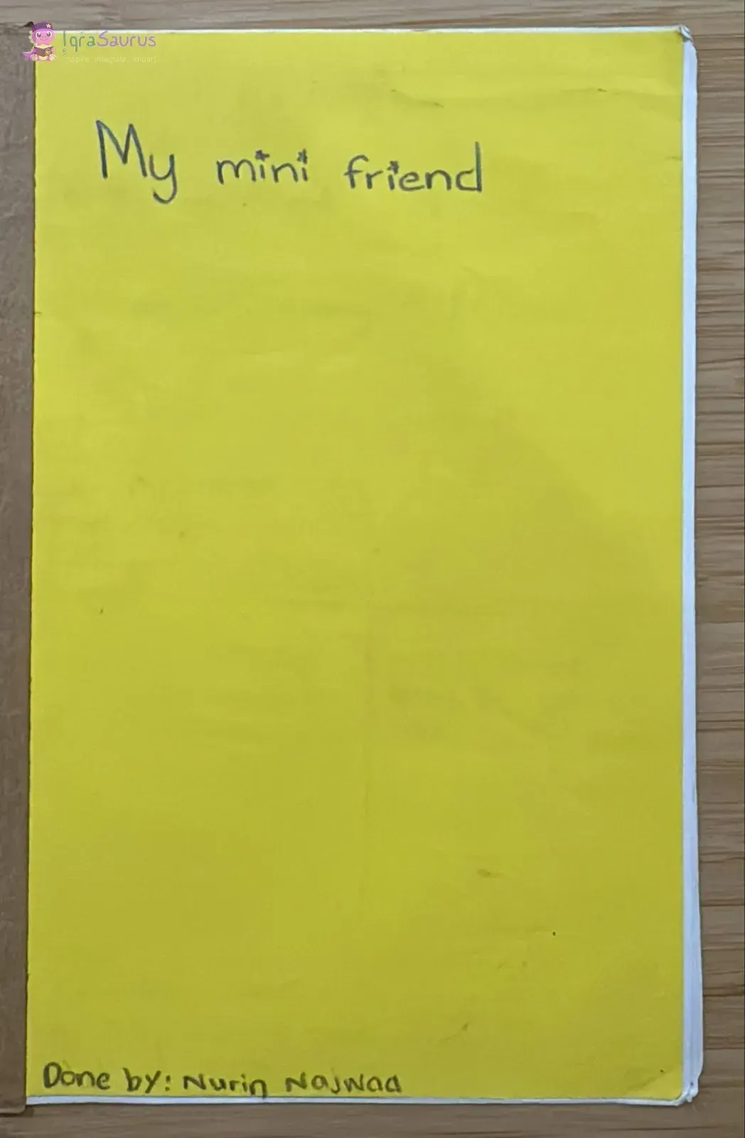 The yellow back cover of the notebook used as the front of a second book, My mini friend.