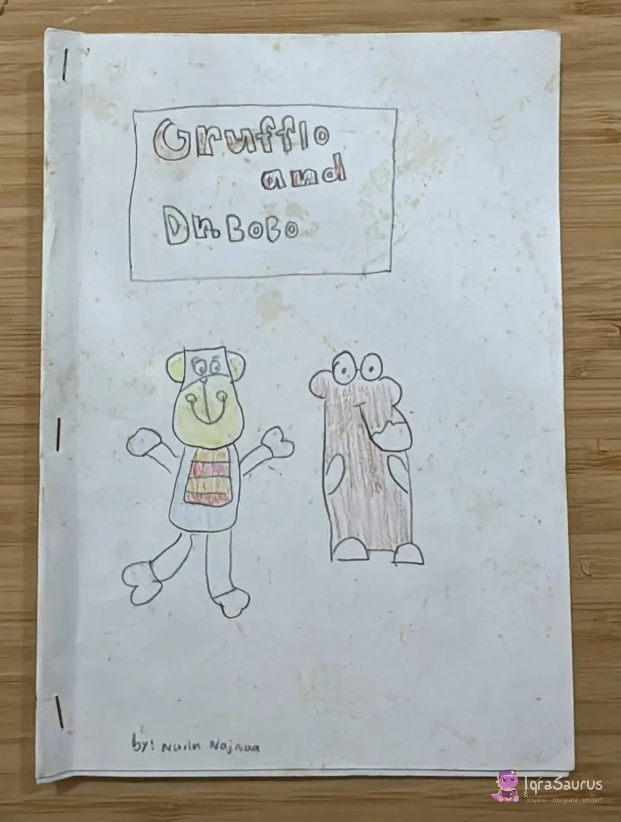 The cover of Nurin's handmade book Gruffalo and Dr. Bobo, with the Gruffalo and a teddy bear