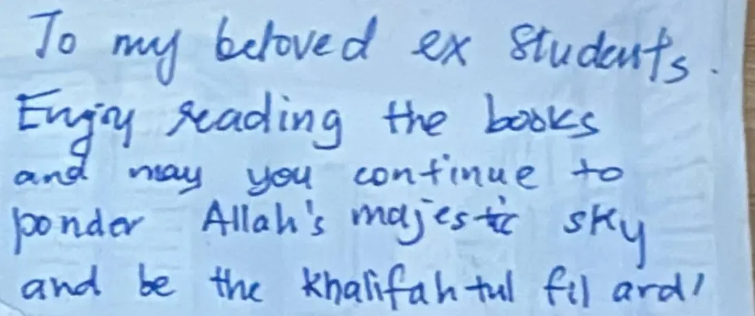A handwritten note on a small card
