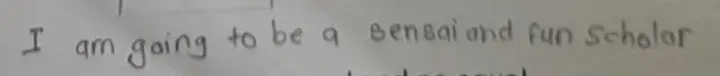 A child's handwriting on an Al-Ikhlas worksheet